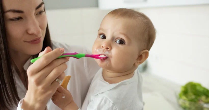 mother-feed-cute-baby-with-spoon